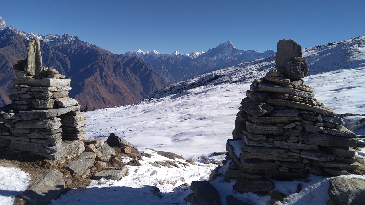 distant himalayan mountain peak visible from kuari pass 